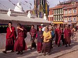 Kathmandu Boudhanath 18 Monks and Pilgrims Circumambulate Stupa The local Tibetan population, including monks, nuns and pilgrims circle the Boudhanath Stupa all day long.